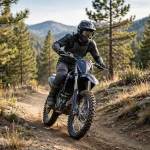 Motocross rider wearing goggles correctly over a dirt bike helmet on a trail