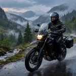 Motorcyclist riding in the rain with a clear helmet visor at dusk