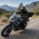 Motorcyclist riding at highway speed with wind pressing on the helmet