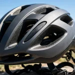 Close-up of large cooling vents on an e-bike helmet in summer sun